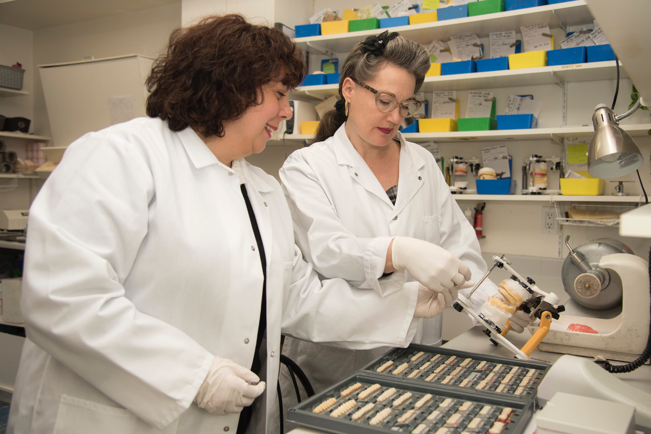 Cecilia and Saveria working on a set of dentures